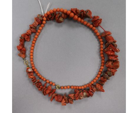 A red coral boulder necklace and a coral bead necklace.