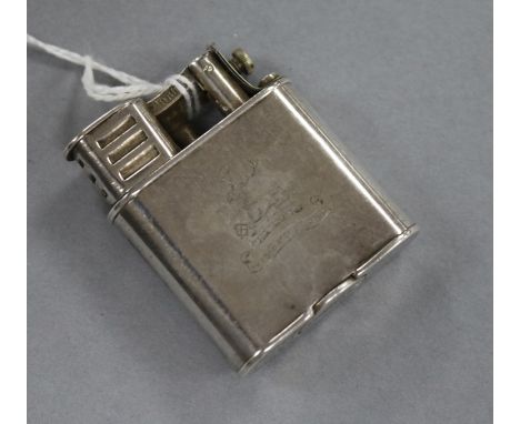 A Dunhill white metal lighter, with engraved crest, 50mm.