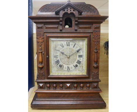 A late 19th century German mahogany cuckoo clock, of architectural form, the cuckoo appearing beneath a roofed canopy, the 5 