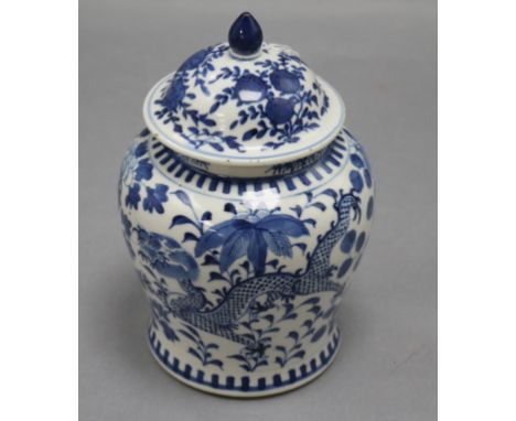 A 19th century Chinese blue and white vase and cover, decorated with dragons height 20cm