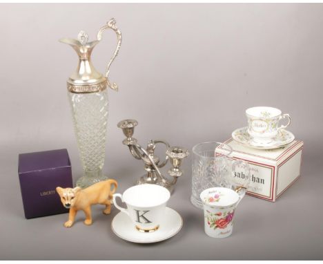 A mixed group to include Beswick ceramic lioness, cut glass carafe, silver plate candelabra etc.  