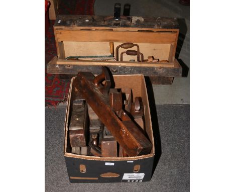 A vintage carpenters tool chest and contents of wood working tools, along with a box of wood planes.  