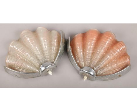A pair of glass and chrome art deco shell wall lights.  Nibbles to glass around the edge of both.