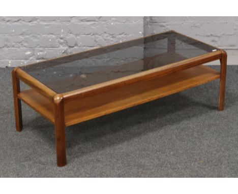 A teak mid century glass top coffee table with under storage shelf, 104cm x 46cm x 36cm  