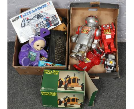 Two boxes of children's toys Walking Talking Toby Robot, Teletubby Tinky Winky, Dominoes, Heavy duty Tractor etc to include B