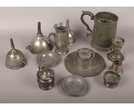 A collection of pewter to include capstan inkwell, tankard, funnels etc.  