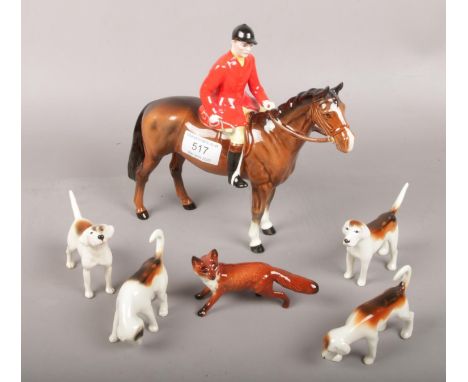 A collection of Beswick ceramic figurines to include Huntsman, hounds and fox.  