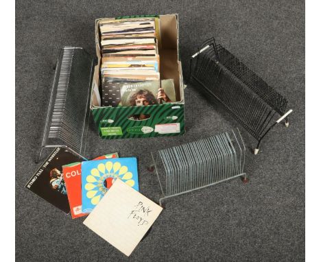 A box of Rock single records, to include The Rolling Stones, Pink Floyd, Guns N' Roses etc. along with three singles stands. 