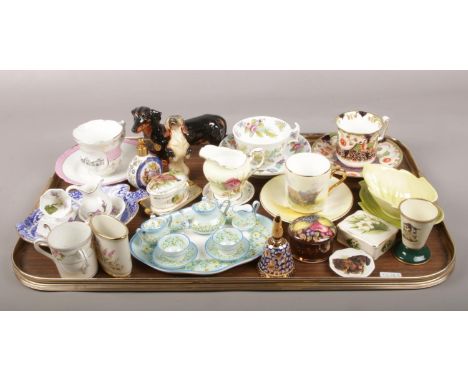 A tray of bone china, to include Royal Staffordshire miniature tea set, Royal Doulton dog, Carltonware etc  Cups and saucers,