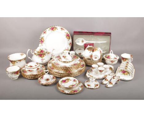 A Royal Albert old country roses part dinner service to include teapot, toast rack, boxed salad servers, dinner plates etc, a