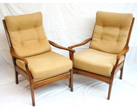 PAIR OF 1950's MAHOGANY OPEN ARMCHAIRS
with padded button backs and stuff over seats flanked by shaped arms, standing on tape