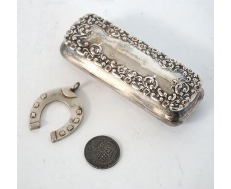 VICTORIAN SILVER TRINKET BOX
with embossed floral and scroll decoration to the cover, hallmarked for Chester 1900, 8.5cm wide