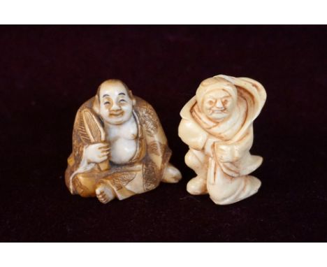 JAPANESE CARVED IVORY NETSUKE
of a man seated cross legged fanning himself, 4cm high; and a Japanese carved ivory netsuke of 