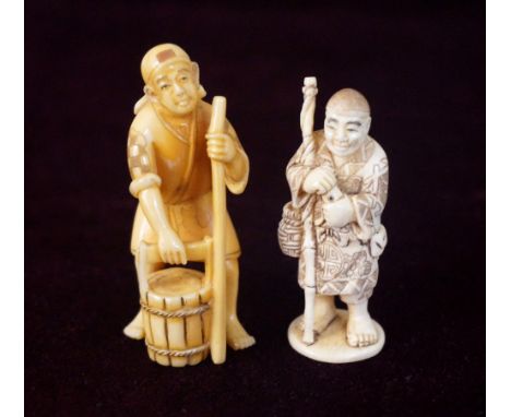 JAPANESE CARVED IVORY NETSUKE
of an old fisherman standing with his rod, 5.4cm high; and an ivory netsuke of a man with a pai