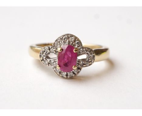 RUBY AND DIAMOND DRESS RING
the central oval cut ruby in pierced multi diamond setting, on nine carat gold shank, ring size L