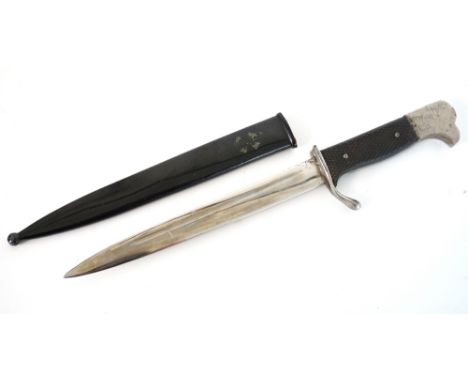 GERMAN MILITARY PAPER KNIFE
early 20th century, modelled as a parade bayonet with chequered bakelite grips, the scabbard with