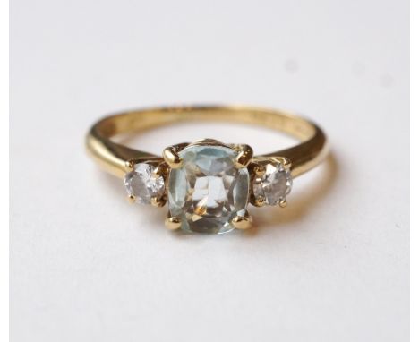 AQUAMARINE AND DIAMOND THREE STONE RING
on nine carat gold shank, the central cushion cut aquamarine flanked by round brillia