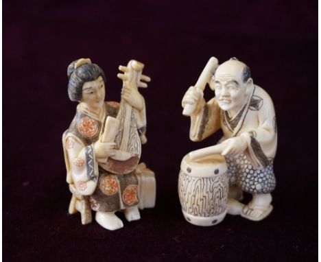 JAPANESE IVORY NETSUKE
of a woman with a biwa, signed either Syugyoku or Hidemasa, 5.3cm high; and an ivory netsuke of a man 