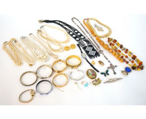 SELECTION OF COSTUME JEWELLERY
including a rolled gold bangle, a Machaela Frey enamelled bangle, bead necklaces, simulated pe