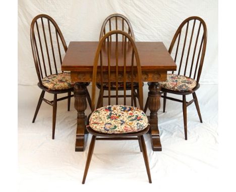 OAK DRAW LEAF DINING TABLE
with a carved frieze and standing on bulbous carved supports united by a stretcher, 148cm extended