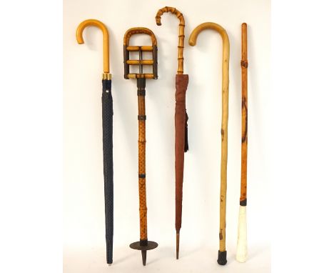 VINTAGE BAMBOO SHOOTING STICK
with metal mounts, two umbrellas, walking cane and a shoe horn with long leather covered handle