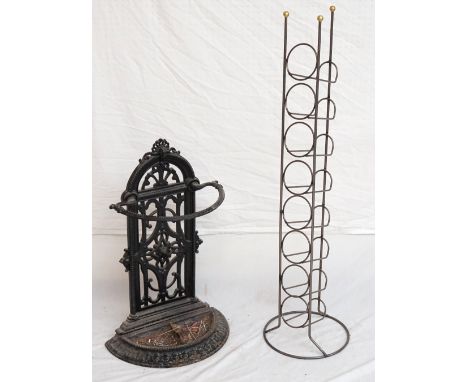 VICTORIAN CAST IRON STICK STAND 
with an arched pierced back with shell motif, the base with stylized decoration, 69cm high, 