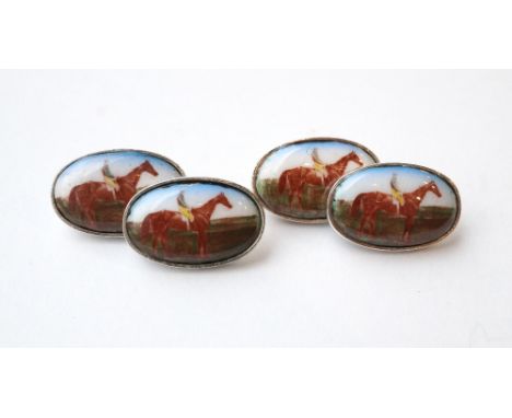 PAIR OF SILVER AND ENAMEL RACING INTEREST CUFFLINKS
the oval enamel panels depicting race horses and jockeys