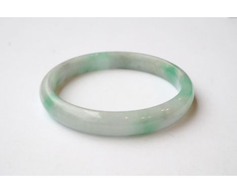 MOTTLED JADE BANGLE
approximately 7.6cm diameter