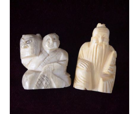 JAPANESE CARVED IVORY NETSUKE
of a wise old man seated holding a book, 4.3cm high; and a carved netsuke of a man seated holdi