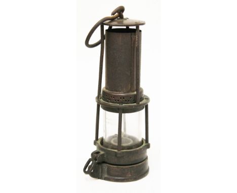 A miners lamp indistinctly stamped 'Bolton & Son(?) Makers Wigan' to top and also 'BCCK 269' & '105' to base, height 23.5cm. 
