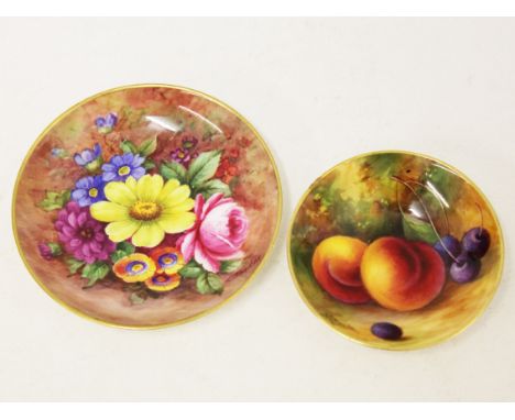 Two Royal Worcester dishes, one signed 'E Barker', the other 'A Shuck', diam. 7cm & 9cm. Condition - minor chip to rim on sma