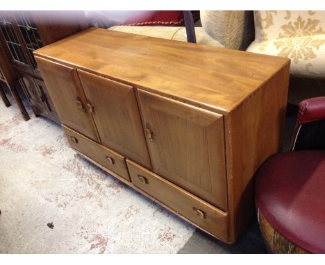 An Ercol light elm sideboard