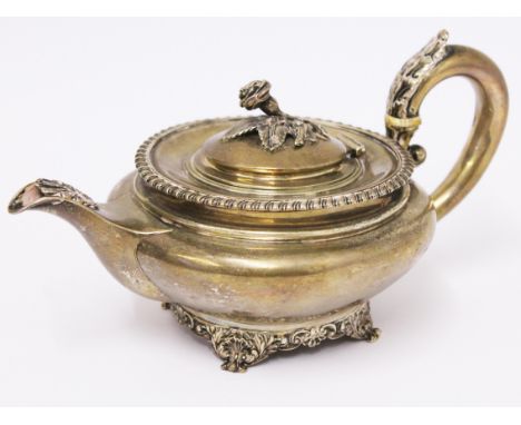 A William IV silver teapot with rose finial and scroll feet by William Bateman II, London 1833, wt. 14oz, length 21cm. Condit