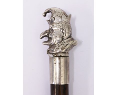 A walking cane the finial with white metal cast of Mr Punch