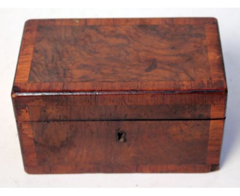A 19th Century cross banded walnut tea caddy, length 18cm. Condition - small chip to veneer, general wear.