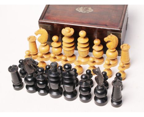 A box wood and ebony chess set with metal bound box. Condition - top missing to black queen, finial missing to a white pawn a