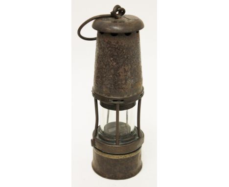 A Wolf miners safety lamp, numbered '20' to top, height 29cm. Condition - generally a little tired.