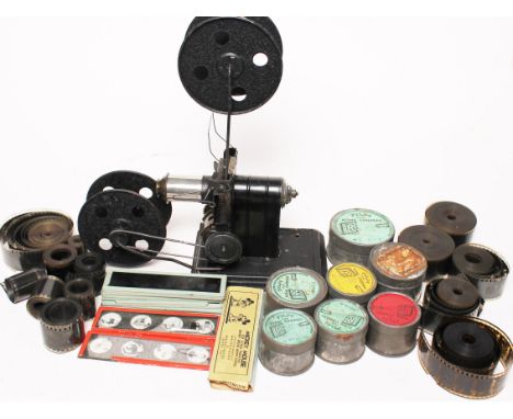 An Ernst Plank style German tin plate projector with various films and slides. Condition - viewing advised…