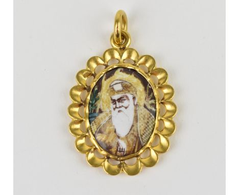A yellow metal and enamel religious Indian pendant, with central enamel miniature portrait of a Sikh guru to the front and ru