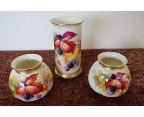 Group of three Royal Worcester vases, including a pair of No. 158 vases with still life blackberry pattern and a similar patt