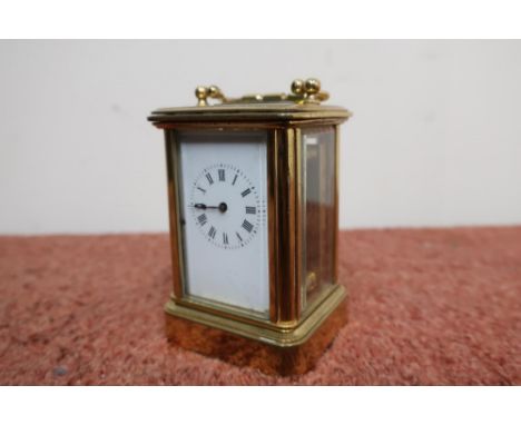 Miniature brass cased carriage clock with bevelled edge panels and white enamel dial (height 8cm) 
