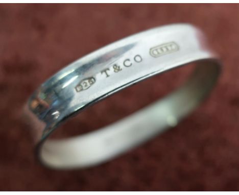 Boxed Tiffany and Co silver hallmarked bangle stamped 2003 Tiffany and Co 925 to the inside and further stamps to the outer 