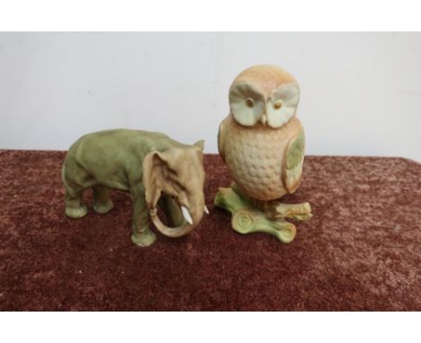Royal Worcester style figure of an elephant No. 107 and a similar figure of an owl, the base marked 26 (2) 