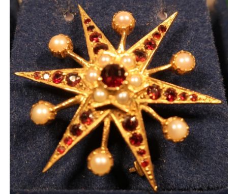 Unmarked yellow metal seed pearl and garnet star shaped bar brooch 