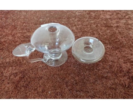 Small Georgian clear glass oil lamp with large thumb mount handle, the body of tapering form on circular base (height 7.5cm) 