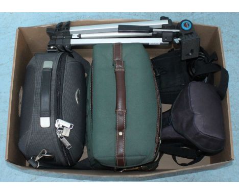 A Canon 350D camera with two lenses in case, together with three other cameras in cases and a tripod