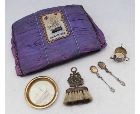 An early 20th century satin tea-cosy with a silk-embroidered patch of HMS Victory, together with a HMS Victory photographic c
