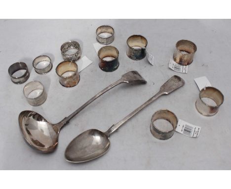 A silver basting spoon, London, 1841, maker's mark of Charles Lias, together with five silver napkin rings including makers H