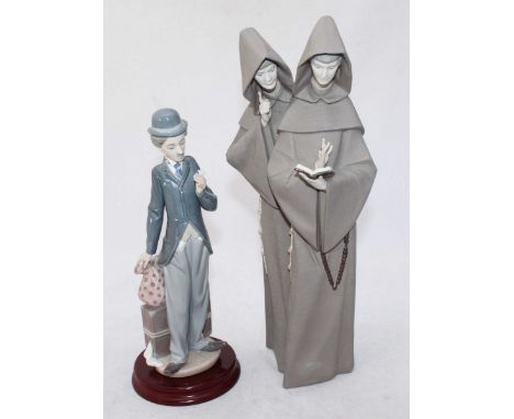 A Lladro porcelain figure 'Charlie the Tramp' no.5233, on turned wooden base, 28cm high excluding base, together with a matt 