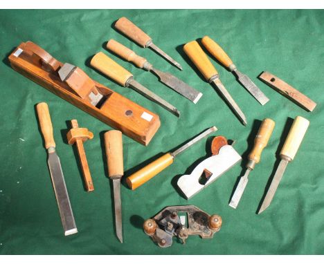 A collection of assorted shipwrights wood-working tools including a large plane and various chisels etc.